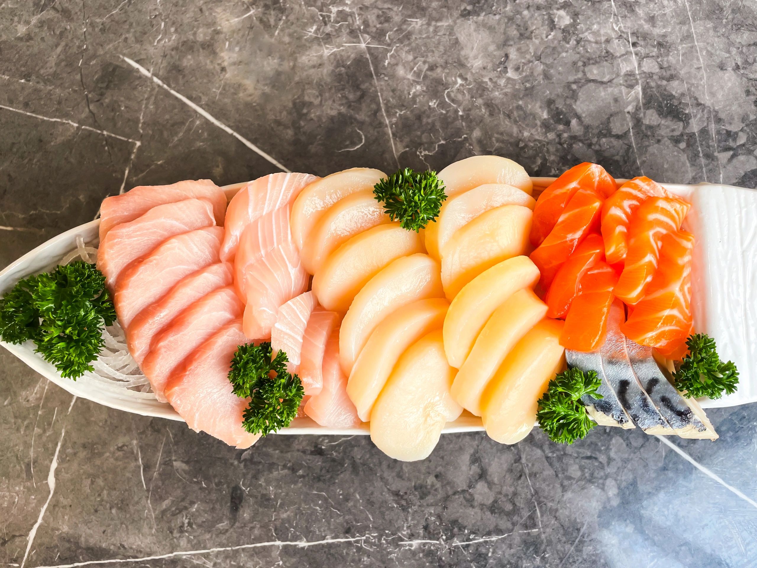 Premium Assorted Sashimi Platter with Salmon, Scallop and White Fish on Boat Plate